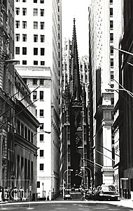Black and white photo of Wall Street and Trinity Church in Lower Manhattan