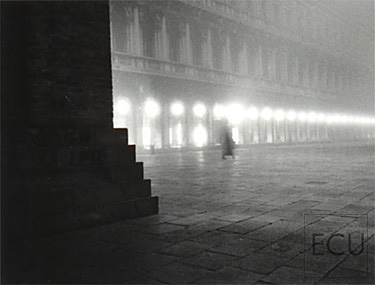 Black and white photo of the Piazza San Marco and the Campanile in the fog in winter, Venice, Italy