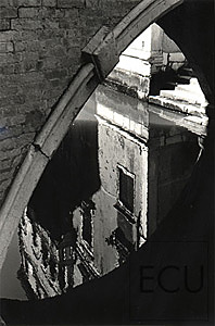 Black and white photo of the Ponte Widmann capturing reflection of an adjacent palazzo in Venice, Italy