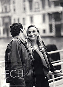 Black and white photos of Vanessa and Mauro on the vaporetto stop of San Toma on the Grand Canal in Venice, Italy