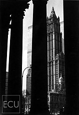 Black and white photo of the landmark Woolworth Building located on Broadway taken from the Municipal Building with views of the original World Trade Center