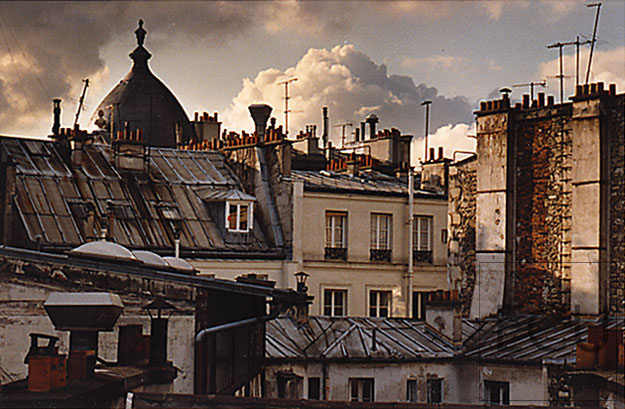 Color photograph of Parisian rooftops shot from Hôtel des Academies on rue de la Grande Chaumière in Montparnasse and 6th arrondisement, Paris, France
