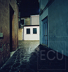 Color photo of a night view of a street on the island of Burano in Venice, Italy