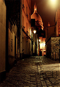 Color photograph at night of the landmark church Sacré Coeur in Montmartre section in the 18th arrondisement in Paris
