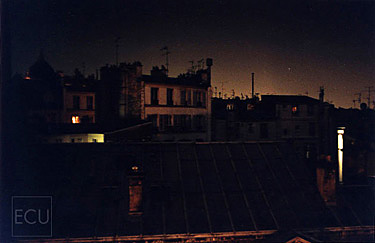 Color photograph of Parisian rooftops shot from Hôtel des Academies on rue de la Grande Chaumière in Montparnasse and 6th arrondisement in Paris, France