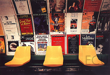 Color photograph of interior of the metro stop Arts-et-Métiers in the 3rd arrondisement, Paris featuring classic advertisement posters characteristic of Paris métro