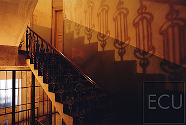 Color photo triptych of a stairs in shadows in Prague in the Czech Republic reflecting Prague's classical architecture