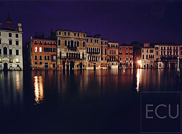 Color photo of the palazzo on the Ca d'Oro side of the Grand Canal at night in winter in Venice, Italy