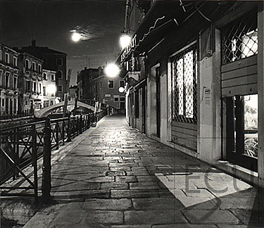 Black and white photo of a quiet street Fondamenta Minotto in the Santa Croce sestiere in Venice, Italy